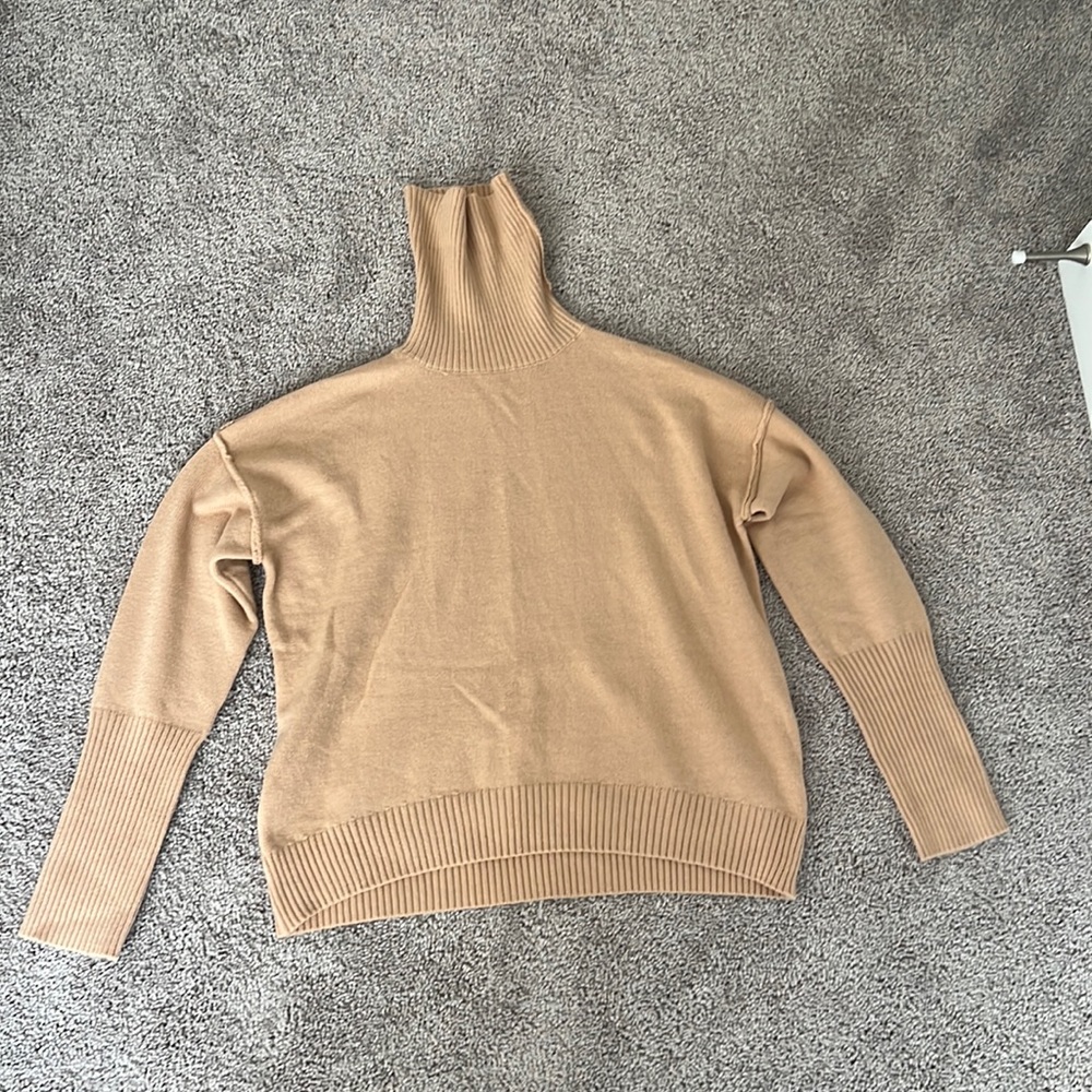 tan turtleneck sweater